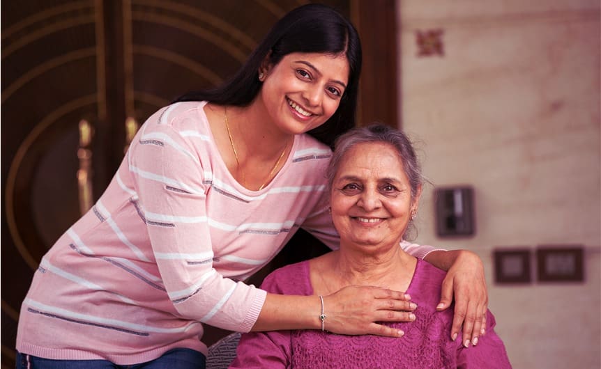 Elderly woman in delhi with a caretaker