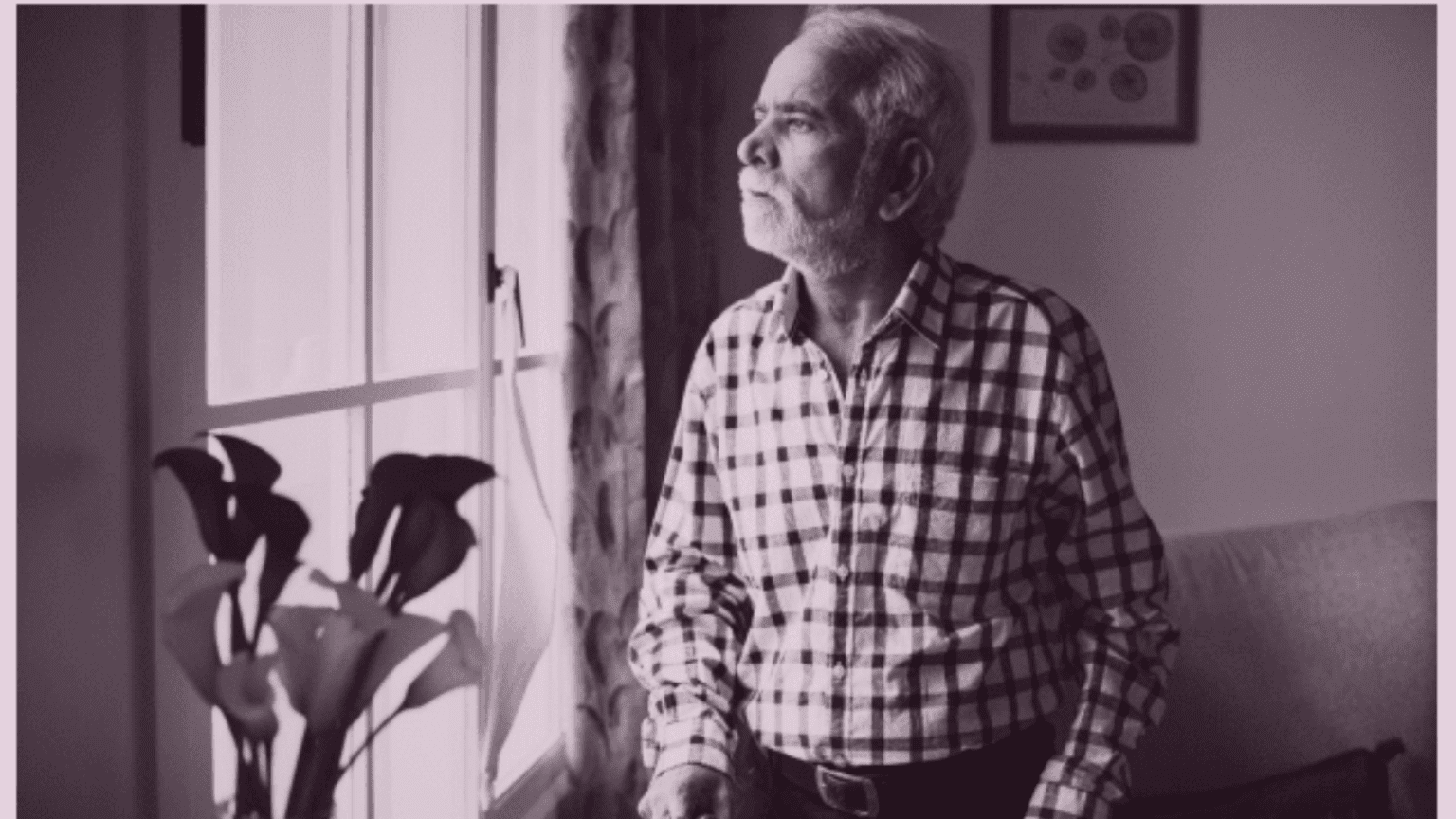 Elderly parent sitting at home showing signs of social withdrawal