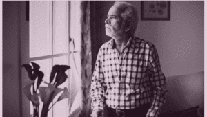 Elderly parent sitting at home showing signs of social withdrawal