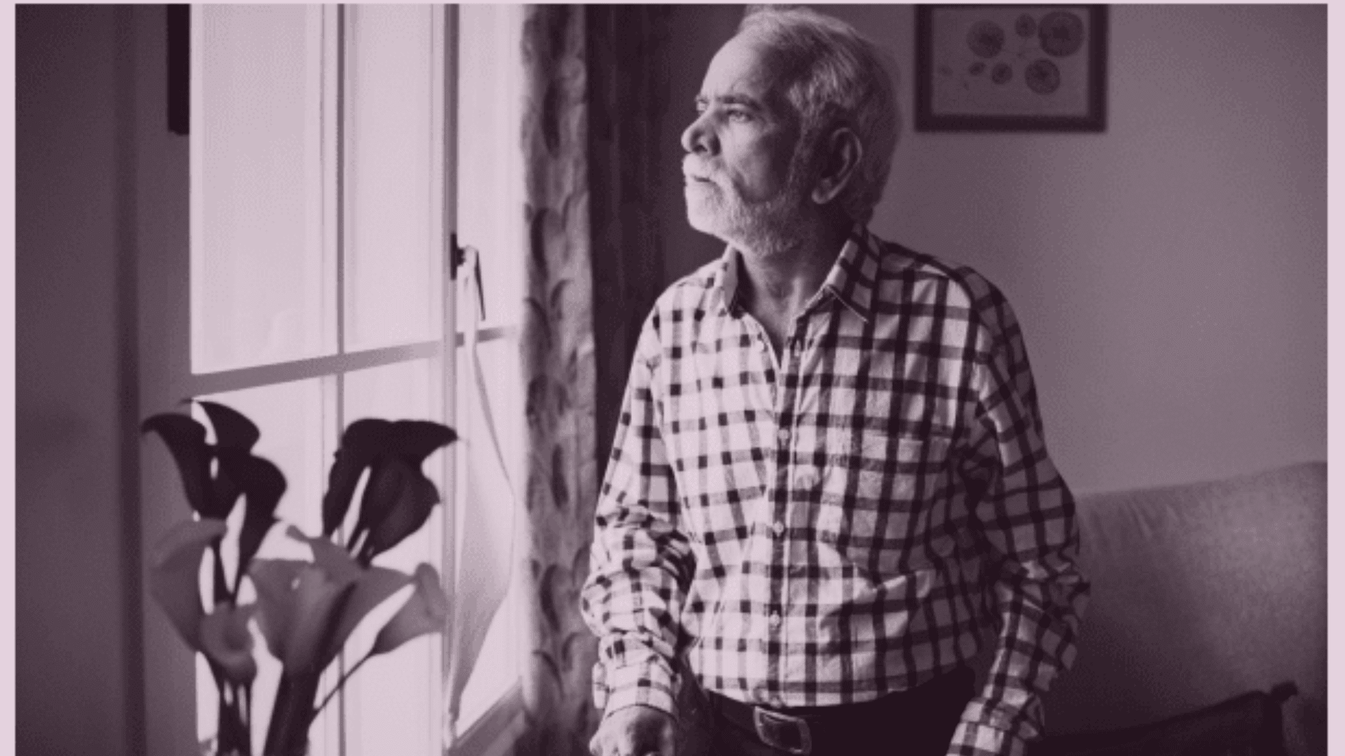 Elderly parent sitting at home showing signs of social withdrawal