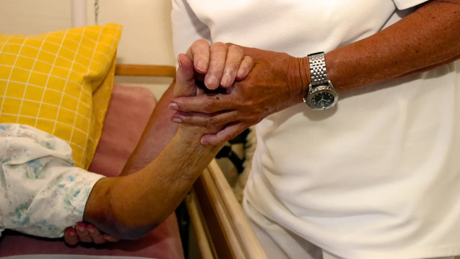 Elderly parent recovering at home in India after a heart attack with family support