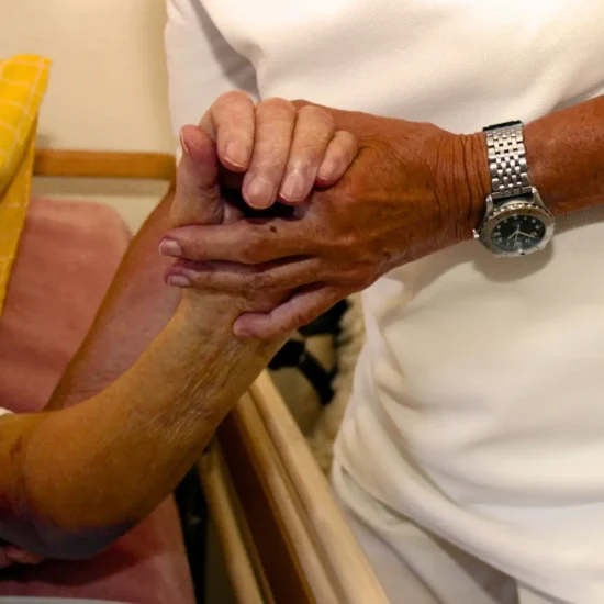 Elderly parent recovering at home in India after a heart attack with family support