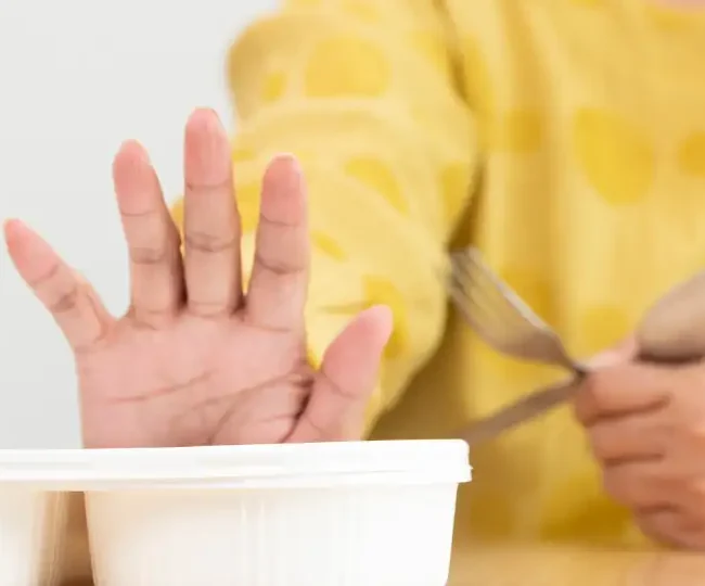 Elderly parent eating alone at home