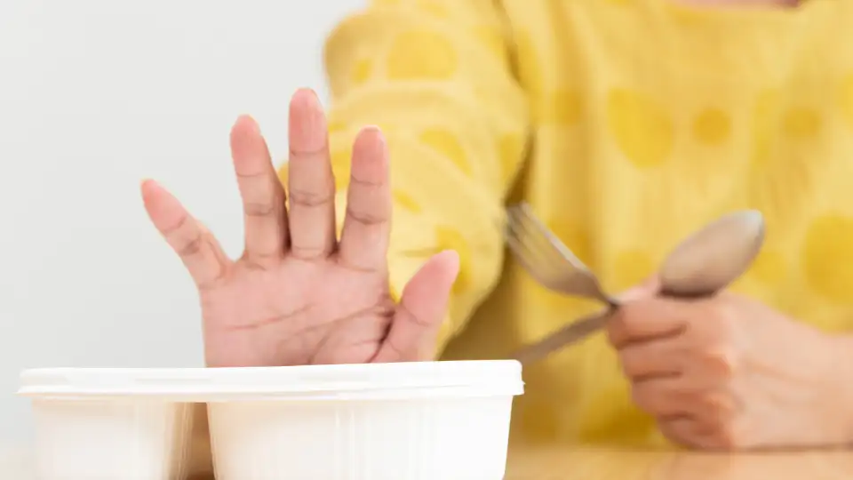Elderly parent eating alone at home