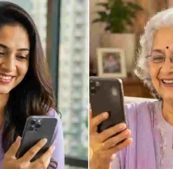 Elderly Indian parent looking worried at a WhatsApp scam message on a smartphone
