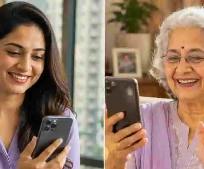 Elderly Indian parent looking worried at a WhatsApp scam message on a smartphone