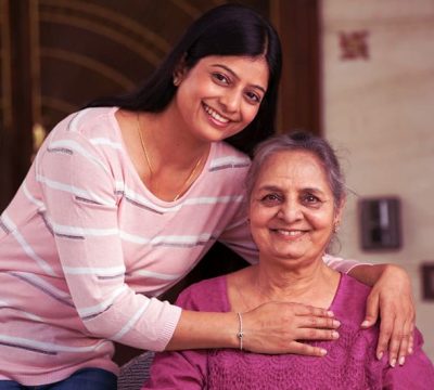 Elderly woman in delhi with a caretaker